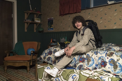 Dustin (Gaten Matarazzo) suited up on the set of Stranger Things 2 with all his Ghostbusters gear and custom sneakers.