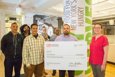 Antonio Ramos, General Manager of BJ's Wholesale Club in College Point, NY (second from right) presents $100,000 donation from BJ's Charitable Foundation to City Harvest.