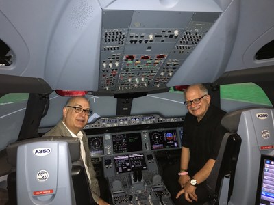 Miami-Dade Aviation Director González (left) and Florida International University President Mark B. Rosenberg, during a recent visit to the Airbus Training Center.