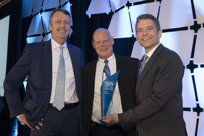 Lyell Farquharson (Vice President, Sales and Distribution) and Robert Dungan (Director, Business Development) with the winner of Top Growth Consolidator, Huntington Travel (CNW Group/WestJet)