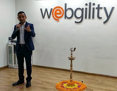 Webgilty CEO Parag Mamnani makes remarks at the opening of the new office.