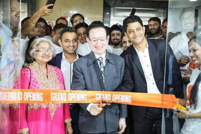 Webgility CEO Parag Mamnani (left) and India Director of Operations Manoj Chhablani (right) watch as Mamnani's parents cut the ribbon on the new Indore office.