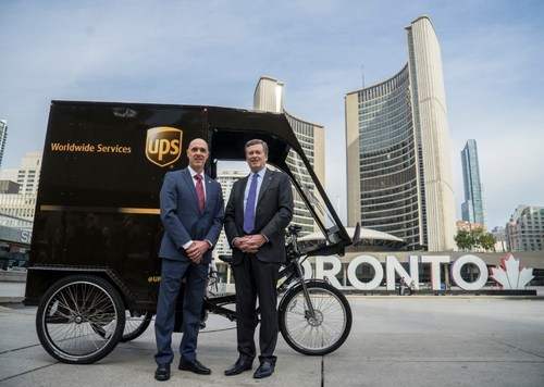 Toronto Mayor John Tory and UPS Canada president, Christoph Atz are photographed at the UPS cargo bike pilot launch in front of Toronto City Hall. (From left to right: Christoph Atz, president of UPS Canada, Toronto Mayor John Tory.) (CNW Group/UPS Canada Ltd.)