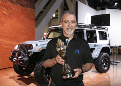 Pietro Gorlier, Head of Parts and Service (Mopar) - FCA, with the "Hottest 4x4-SUV" award, claimed by the Jeep(r) Wrangler for the eighth consecutive year at the Specialty Equipment Market Association (SEMA) Show in Las Vegas.