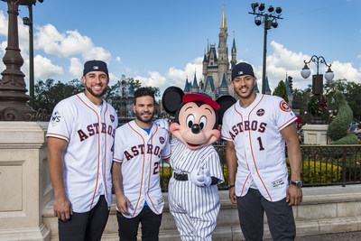 Houston Astros star players (l-r) World Series MVP George Springer, American League batting champion Jose Altuve and All-Star Carlos Correa team up with Mickey Mouse for a World Series victory parade Saturday, Nov. 4, 2017, at Magic Kingdom Park in Lake Buena Vista, Fla. The Walt Disney World Parade saluted the team's first world title in its 56-year history. (Matt Stroshane, photographer)