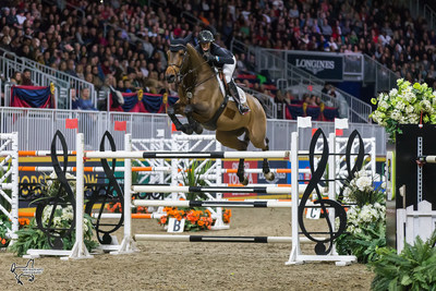 Amy Millar of Perth, ON, claimed her first Canadian Show Jumping Championship title riding Heros on Saturday, November 4, at the Royal Horse Show in Toronto, ON. Photo by Ben Radvanyi Photography (CNW Group/Royal Agricultural Winter Fair)