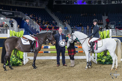 Marion Cunningham and Bill Tilford of MarBill Hill Farm present Grace Munro (left) aboard Ever So Clever and Makayla Clarke (right) aboard Twisted as co-winners of $5,000 MarBill Hill Royal Pony Jumper Final on Sunday, November 5, at the Royal Horse Show in Toronto, ON. Photo by Ben Radvanyi Photography (CNW Group/Royal Agricultural Winter Fair)