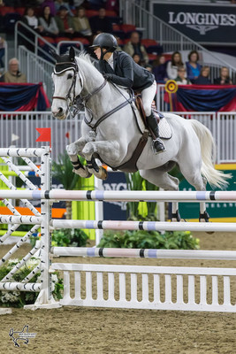 Julia Madigan of Vancouver, BC, won the $10,000 Junior/Amateur 1.40m Jumper Stake riding Farfelu du Printemps on Sunday, November 5, at the Royal Horse Show in Toronto, ON. Photo by Ben Radvanyi Photography (CNW Group/Royal Agricultural Winter Fair)