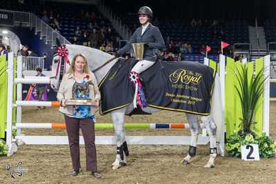 Julia Madigan and Farfelu du Printemps were presented with the Canadian Equestrian Team Challenge Trophy as the Junior/Amateur Jumper Champions by Karen Hendry-Ouellette of Equestrian Canada, on Sunday, November 5, at the Royal Horse Show in Toronto, ON. Photo by Ben Radvanyi Photography (CNW Group/Royal Agricultural Winter Fair)