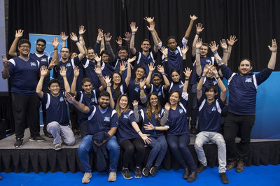 Participants of Capital One Canada's second annual Gift the Code Hackathon take the stage after receiving the Implementation Team award for presenting solutions to digital challenges faced by six Toronto-based charities. (CNW Group/Capital One Canada)