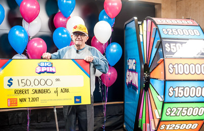 Robert (Bob) Saunders of Ajax celebrates after spinning THE BIG SPIN Wheel at the OLG Prize Centre in Toronto to win $150,000. Saunders won a top prize with OLG’s new INSTANT game – THE BIG SPIN. (CNW Group/OLG Winners)