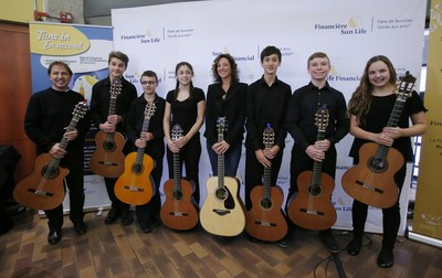 Grammy and Juno-Award winning Canadian music icon, Sarah McLachlan, with student performers from Suzuki Music of Ottawa. (CNW Group/Sun Life Financial Inc.)