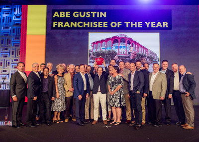 Apple American Group Chairman and CEO Greg Flynn and his team celebrate winning the Abe Gustin Franchisee of the Year Award at the 2017 Applebee’s Fall Franchise Conference in Boca Raton, Florida on Sunday, Oct. 29, 2017.
