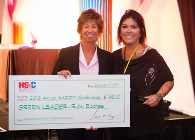 From left are Michele Penrose, Director of Global Professional Relations for Henry Schein, Inc., and Ruby Eaches, Practice Manager for North Carolina-based Surf City Dental. Ms. Eaches is the winner of the American Association of Dental Office Management's fifth annual Green Leader Award. AADOM created the award as part of its Green Leader Initiative, which was made possible by a grant from the Henry Schein Cares Foundation.