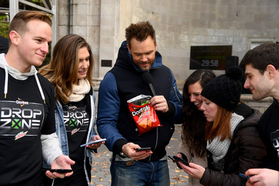 Joel McHale gifts new Xbox One X consoles in New York City to winning players in Mtn Dew, Doritos and Xbox Drop Zone, the first of this weekend’s nationwide, augmented reality capture-the-flag contests.