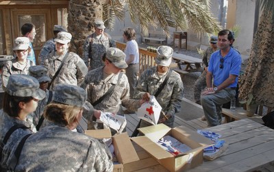 Female soldiers receiving personnel hygiene items from the Red Cross facilities in Baghdad. Photo by Peter Macias/American Red Cross