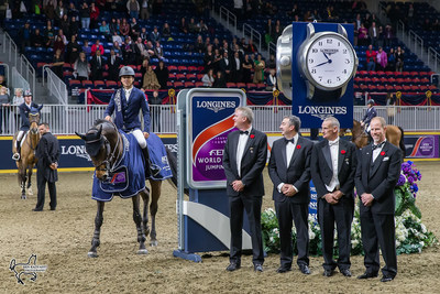 Kent Farrington of the United States aboard Voyeur, presented as winners of the $150,000 Longines FEI World Cup™ Jumping Toronto by, from left to right, Andrew McKee, President and Chairman of the Board of The Royal Agricultural Winter Fair; Charlie Johnstone, CEO of The Royal Agricultural Winter Fair; Iain Gilmour, Chairman of the Royal Horse Show; and Mark Samuel, FEI Bureau Member and Chair of Regional Group IV, on Wednesday, November 8, at the CSI4*-W Royal Horse Show. Photo by Ben Radvanyi (CNW Group/Royal Agricultural Winter Fair)