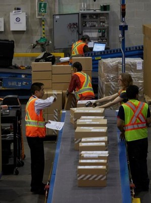 Purolator’s 112 shipping centres will move close to 20 million packages, weighing about 120 million pounds, across Canada, into the United States and around the world this holiday season. (CNW Group/Purolator Inc.)