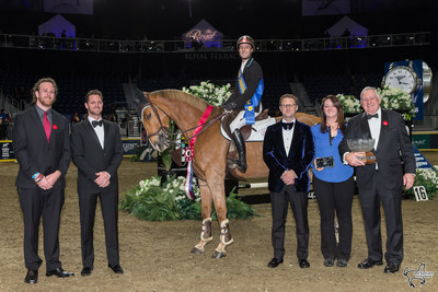 François Lamontagne of St. Eustache, QC, was presented with the Moffat Dunlap Leading Canadian Rider Award while his mount, Chanel du Calvaire, claimed the All-Canadian Cup as the leading Canadian-owned horse during the CSI4*-W Royal Horse Show. The All-Canadian Cup was presented by the Grange Family representing Lothlorien Farm of Cheltenham, ON. Photo by Ben Radvanyi Photography (CNW Group/Royal Agricultural Winter Fair)