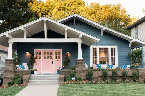 A striking navy and pink color scheme gives HGTV Urban Oasis 2017 major curb appeal. The updated Craftsman-style bungalow is located in Knoxville, Tennessee.