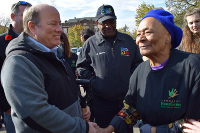 Detroit Mayor Mike Duggan (left) talks with neighborhood resident Minnie Knox during Project EverGreen’s Pingree Park renovation project on November 4.