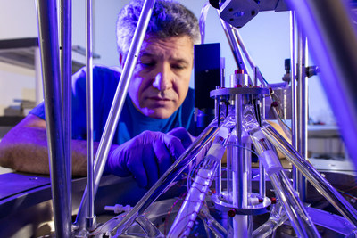 Carlos Sanchez works on the National Research Council of Canada’s Kibble Balance. (CNW Group/National Research Council Canada)