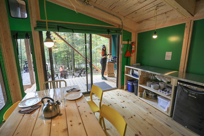 Because nobody comes to the forest to huddle inside like shut-ins, the new ready-to-camp features a patio door to let in all the natural light from outside. (CNW Group/Société des établissements de plein air du Québec)
