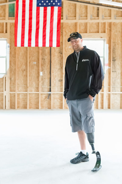 U.S. Army Staff Sgt. Jesse Clingman in his new garage and workout space constructed through Carrington Charitable Foundations and its signature program Carrington House. Photography by Seymour Sport.