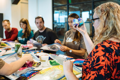 A Days for Girls volunteer visits Classy in San Diego, California, to teach employees how to assemble DfG Kits in preparation for Classy's new philanthropic initiative, ClassyGives.