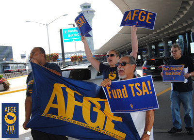 Members of the American Federation of Government Employees rally outside Chicago's O'Hare International Airport last year to support fully funding and staffing the Transportation Security Administration.