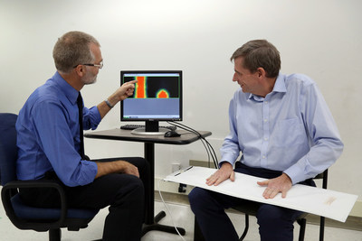 Dr. Frank Knoefel (left) and Dr. Bruce Wallace with a pressure-sensitive mat designed to monitor an older adult's health while they sleep. It's one of the smart technologies being developed at a new AGE-WELL National Innovation Hub at Bruyre Research Institute and Carleton University in Ottawa, Ontario. (CNW Group/AGE-WELL Network of Centres of Excellence (NCE))