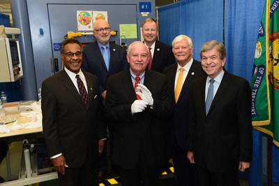 Gerald York, grandson of WWI hero SGT Alvin York, holds the U.S. Mint's newly-minted 2018 WWI Centennial Silver Dollar. He is joined by (l to r) Congressman Emanuel Cleaver, II (D-Missouri), Daniel Basta, U.S. Foundation for the Commemoration of the World Wars, Congressman Doug Lamborn (R-Colorado), U.S. WWI Centennial Commission Chair Terry Hamby and Senator Roy Blunt (R-Missouri). The new commemorative coin was authorized by Congress, through bipartisan legislation. The coin, available to the public in January 2018 via www.usmint.gov, honors America's WWI veterans during the centennial period of the war, and a surcharge will support work of the Foundation.