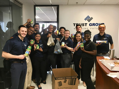 Trust Group CEO Adrian Hyde and team members held a successful food drive in support of the North Texas Food Bank.
