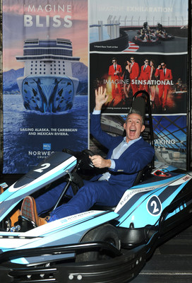 Radio personality Elvis Duran celebrates being named Godfather of Norwegian Cruise Line’s newest ship, Norwegian Bliss, at an event in New York, Wednesday, Nov. 29, 2017. Duran is pictured in an electric car from the largest race track at sea that will be featured on Norwegian Bliss.  (Photo by Diane Bondareff/Invision for Norwegian Cruise Line/AP Images)