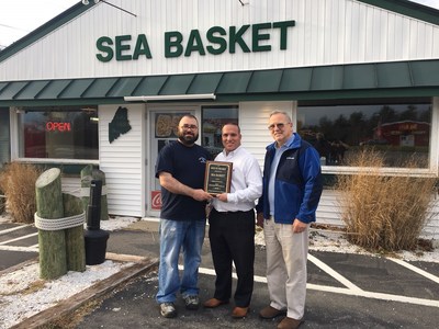 Louis Rylant, owner of the Seabasket Restaurant accepts award for Best Seafood Restaurant Midcoast Maine from Market Surveys of America