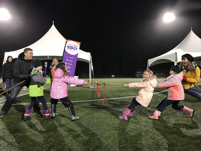 Elio Antunes, President and CEO of ParticipACTION and Play List Ambassador, Sara Hennessey tackle #121 Tug of War with the Girl Guides of Lougheed Area at the final tour stop in Coquitlam, B.C. on November 30. (CNW Group/ParticipACTION)