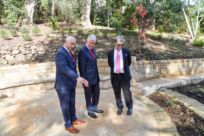 President Bill Clinton pays tribute to those lost to AIDS at National AIDS Memorial during World AIDS Day ceremonies in San Francisco Pictured with the President L-R) John Cunningham, Executive Director and Mike Shriver, Board Chair, National AIDS Memorial. (Photo Credit: Trish Tunney)