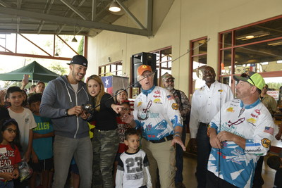 2017 World Series Champion and Houston Astros shortstop, Carlos Correa and fiancé, Daniella Rodriguez, in partnership with Vamos A Pescar, share the joy of fishing with  more than 100 families by reeling in their #FirstCatch at fishing workshop in Katy,TX. (Credit: Anthony Rathbun, AP Newswire)