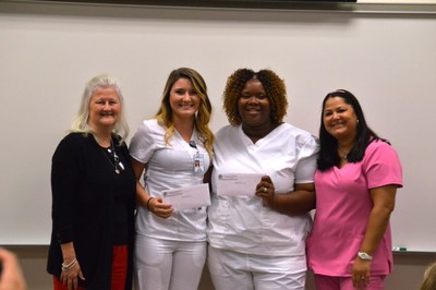 Staywell has established a scholarship program to address the shortage certified nursing assistants (CNA) serving long-term care. Chipola College recently held a graduation ceremony for the Certified Nursing Assistant class, from left: Dr. Karen Lipford, Dean School of Health Sciences, Kristal Whitaker and Myesha Grant received Staywell Way Scholarships, and CNA instructor Annamarie Johnson