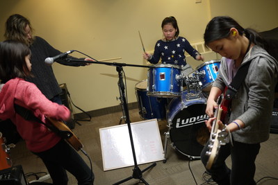 Girls taking part in "Girls Rock Camp" rock out during the March Break session. Girls Rock Camp is a free program offered to Dixon Hall Music School students, due to popular demand. (CNW Group/Dixon Hall Neighbourhood Services)