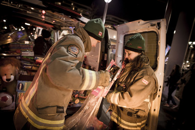 Toronto Fire Fighters unload cargo vans full of toys collected at Mercedes-Benz dealerships across the GTA. A fleet of Mercedes-Benz Vans delivered the toys to the official kick-off for the Fire Fighters Toy Drive at CF Shops at Don Mills. Mercedes-Benz Toronto Retail Group has supported the Toronto Fire Fighters Toy Drive for four years. 