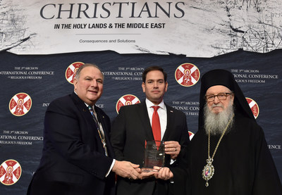 Archbishop Demetrios of America, Primate of the Greek Orthodox Church in the United States, and Dr. Anthony Limberakis, National Commander for the Order of St. Andrew the Apostle, recognize Senator Marco Rubio for his dedication to religious freedom and his defense of Christians persecuted in the Holy Lands and Middle East at the 3rd Archon International Conference on Religious Freedom.