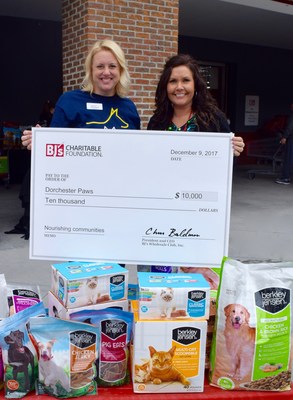 Dawn Albright, general manager of the BJ's Wholesale Club in Summerville, SC, presents a $10,000 grant to Kim Almstedt, executive director of Dorchester Paws.