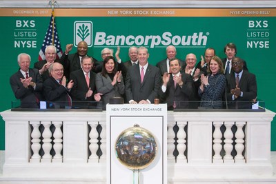BancorpSouth Chairman and Chief Executive Officer Dan Rollins rings the NYSE opening bell on December 11, 2017, celebrating BancorpSouth’s 20th anniversary on the NYSE. Pictured with Rollins are current and former BXS directors.