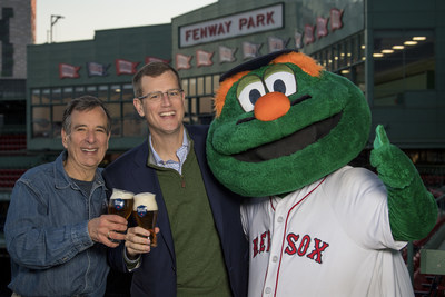 December 7, 2017, Boston, MA: Samuel Adams Founder Jim Koch and Boston Red Sox President and CEO Sam Kennedy pose for a photograph with Boston Red Sox mascot Wally the Green Monster during the announcement of a partnership at Fenway Park in Boston, Massachusetts Thursday, December 7, 2017.  (Photo by Billie Weiss/Boston Red Sox)