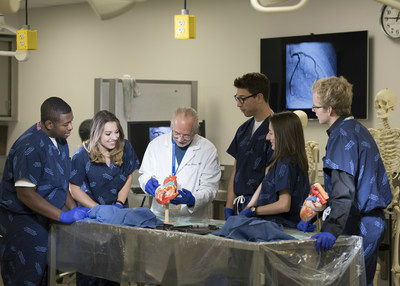 Zucker School of Medicine students receive instruction from William Rennie, MD, associate professor of emergency medicine, in the school's structure lab. From left: Bryce Ingram (second-year student); Tamara Movsesova (first-year student); Dr. Rennie; Samuel Butensky (first-year student); Dillon Gurciullo (first-year student); and Nathan Murray (first-year student).