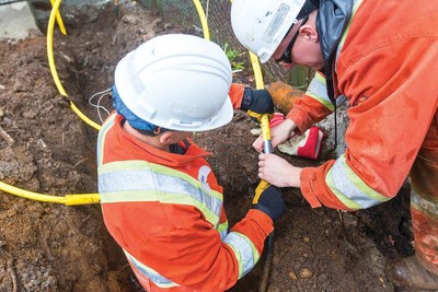 FortisBC crew leader and distribution mechanic connect a customer's home to the FortisBC natural gas delivery system in Metro Vancouver. (CNW Group/FortisBC)