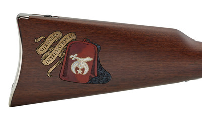 The hand-painted stock’s right side has the ever-present red Fez with black tassel. A gold-painted banner scroll is off to the Fez’s side, on a diagonal, and contains the words “Shriners International.”