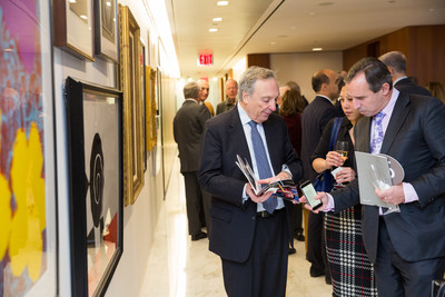 Dr. Charles R. Marmar, Dr. John Golfinos, and Dr. Koto Ishida browse artwork from Andy Warhol, Norman Rockwell, and David Hockney, among others.