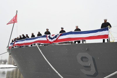 Sailors assigned to the Freedom-variant littoral combat ship USS Little Rock (LCS 9) man the rails as snowflakes fell during the ship’s commissioning ceremony on the Buffalo River on Dec. 16. Photo credit: Lockheed Martin.